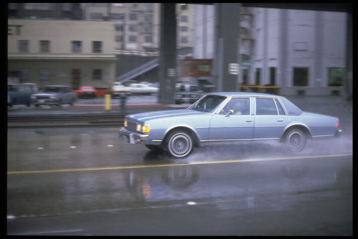 Car in rain Seattle 1980s